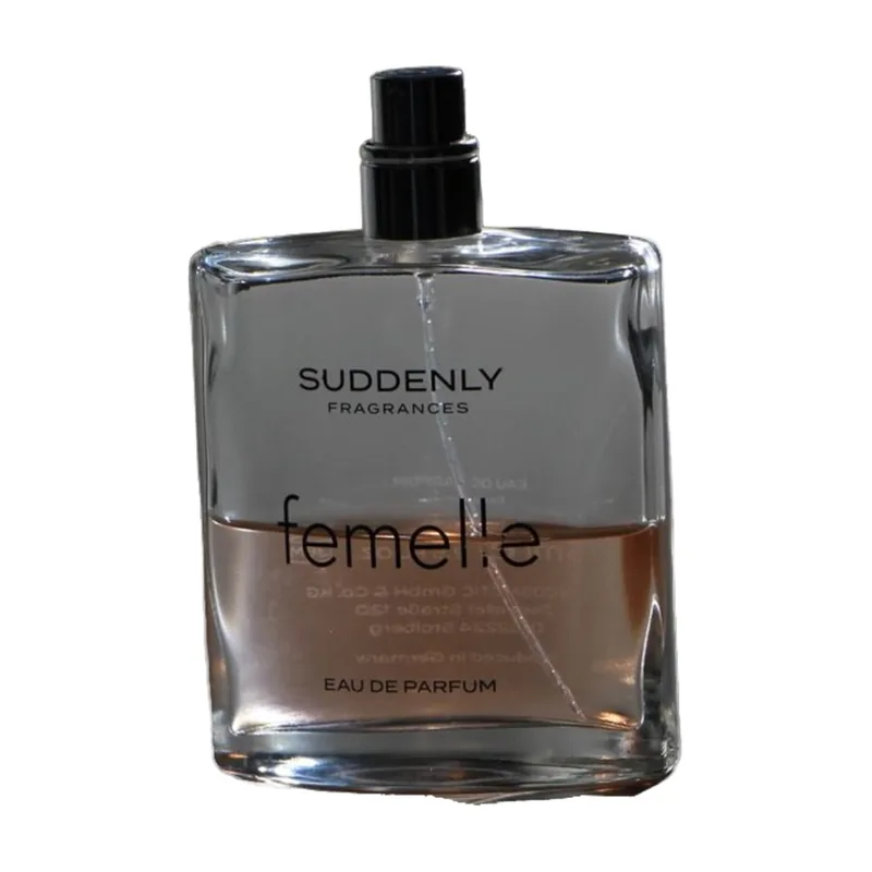 The bottle on pure white with the shadow removed; the dark table still shows through the glass