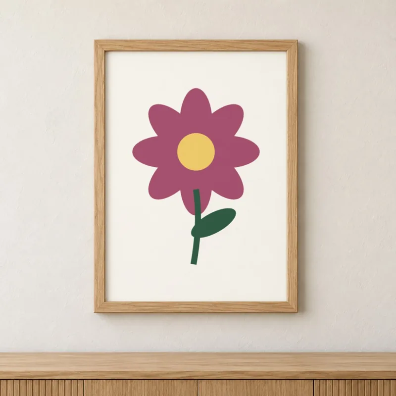 An oak frame on a wall with the same pink flower artwork filling the mat