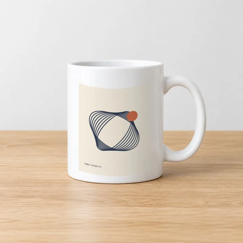 A white mug mockup on a wooden table with an orbit line drawing on a beige rectangle that follows the mug's curve