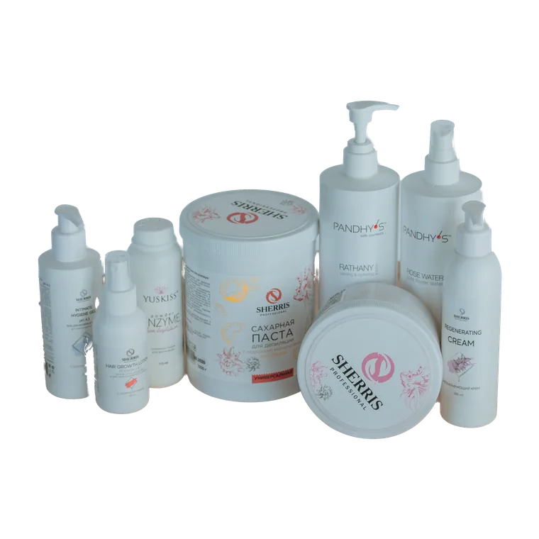 Skincare bottles arranged on a round wooden table