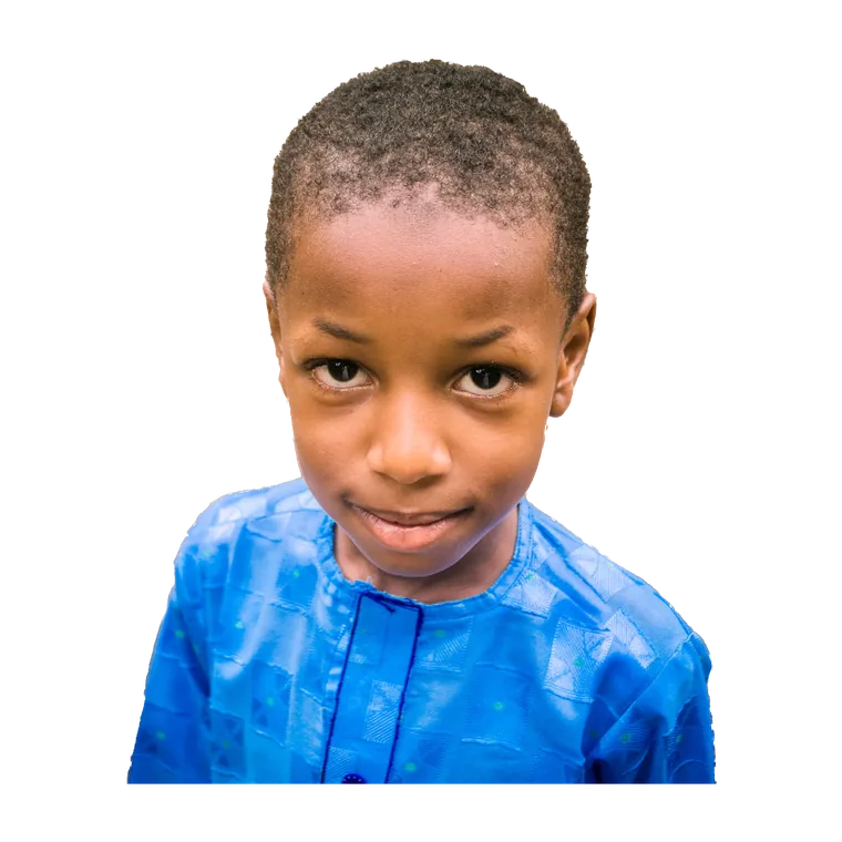 Close portrait of a boy in a bright blue shirt